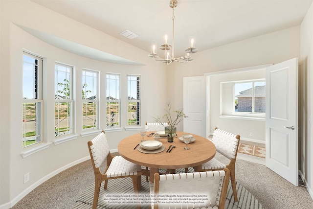 dining area featuring carpet and a wealth of natural light