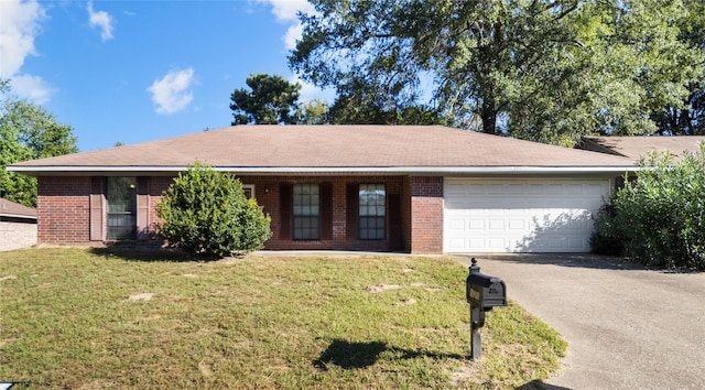 ranch-style home with a front yard and a garage