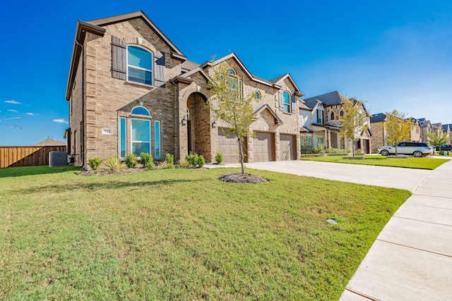 view of front facade with a garage and a front lawn