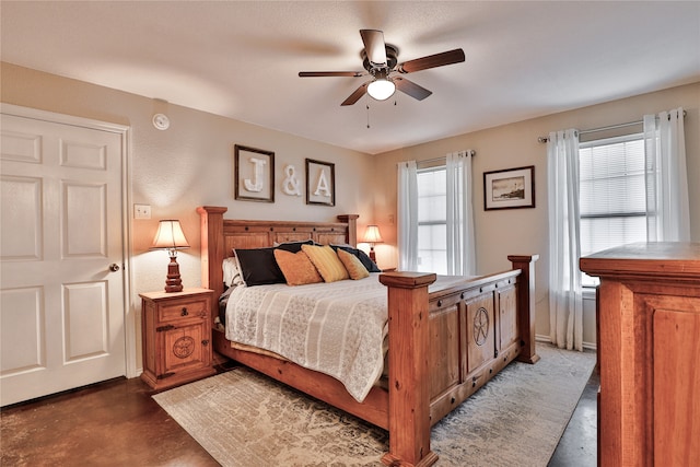 bedroom featuring multiple windows and ceiling fan