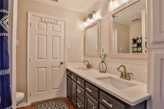 bathroom with vanity and toilet