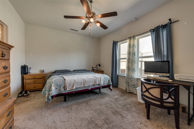 bedroom with light carpet and ceiling fan