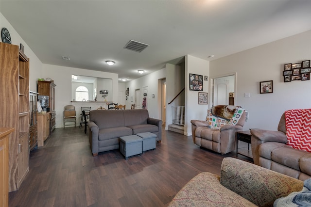 living room with dark hardwood / wood-style flooring