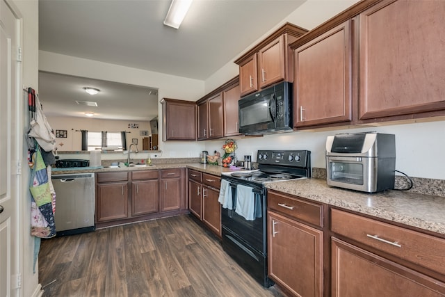 kitchen with sink, dark hardwood / wood-style flooring, and black appliances