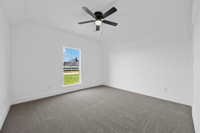 carpeted empty room featuring lofted ceiling and ceiling fan