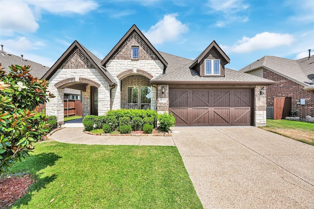 view of front facade featuring a garage and a front lawn