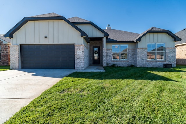 single story home featuring board and batten siding, an attached garage, brick siding, and a front lawn