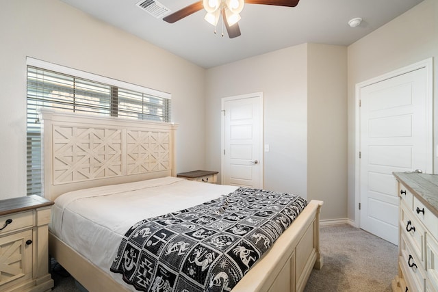 bedroom featuring visible vents, ceiling fan, light colored carpet, and baseboards