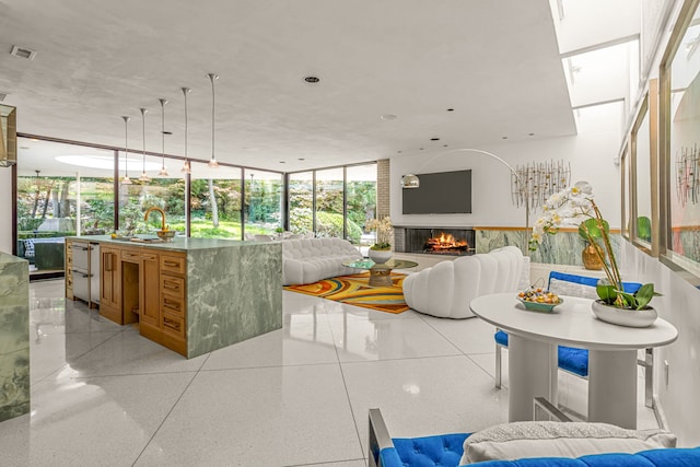 sunroom / solarium with a sink and visible vents