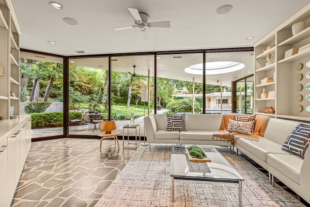 interior space featuring ceiling fan and plenty of natural light