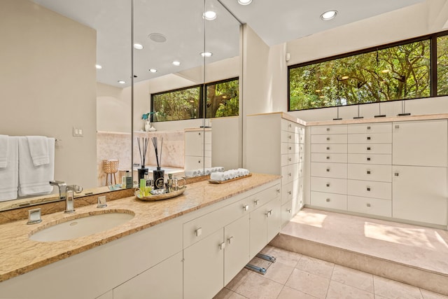 bathroom with tile patterned floors, vanity, and recessed lighting
