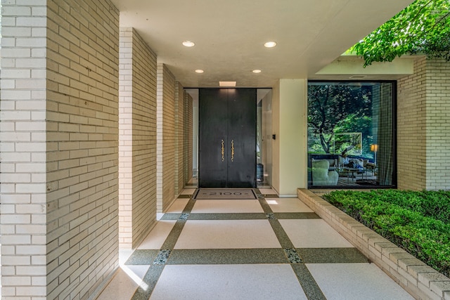 property entrance with brick siding