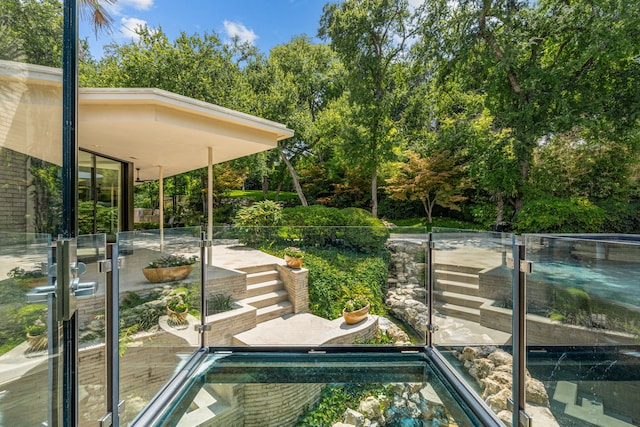 view of property's community featuring a patio