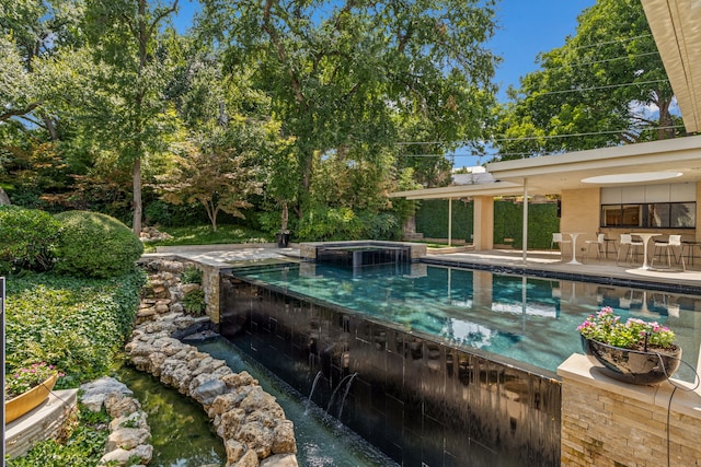 view of pool with a patio area