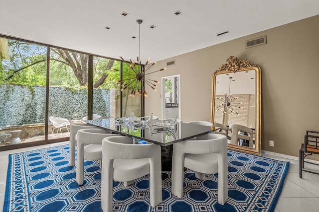 tiled dining area with a notable chandelier and a wealth of natural light