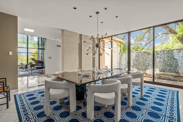 dining area featuring expansive windows, light tile patterned floors, and a chandelier