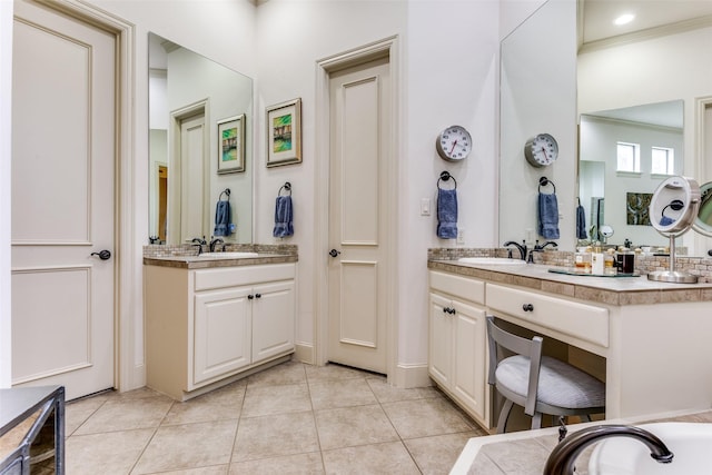 bathroom with vanity, crown molding, and tile patterned floors