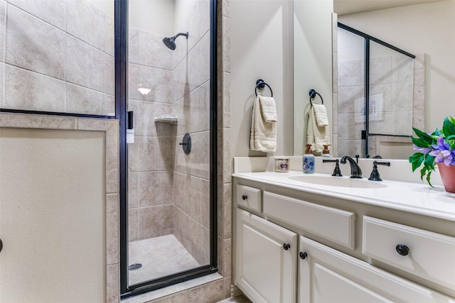 bathroom featuring vanity and walk in shower