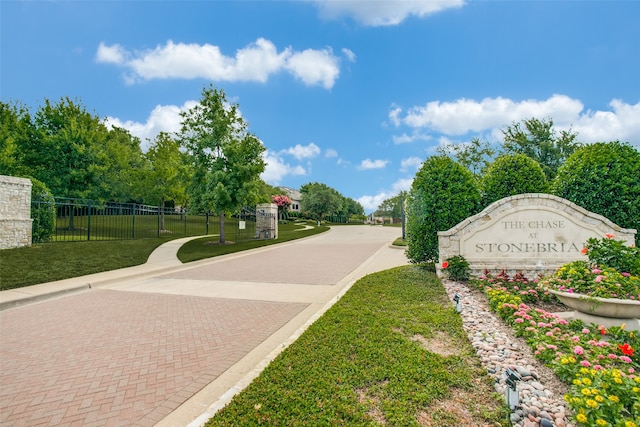 view of home's community with a yard