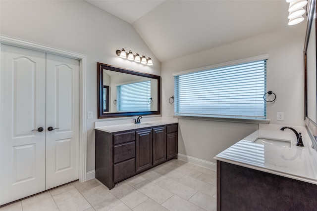 bathroom featuring lofted ceiling, vanity, and tile patterned floors