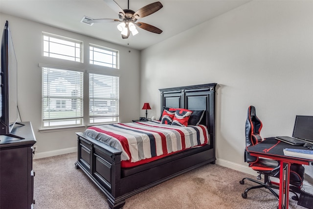 bedroom with ceiling fan and light colored carpet