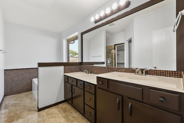 bathroom featuring vanity, plus walk in shower, and tile patterned floors