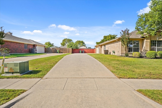 view of front facade featuring a garage and a front lawn