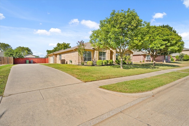 view of front of property featuring a front lawn and central AC