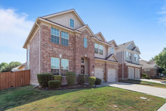 view of front of home featuring a front yard and a garage