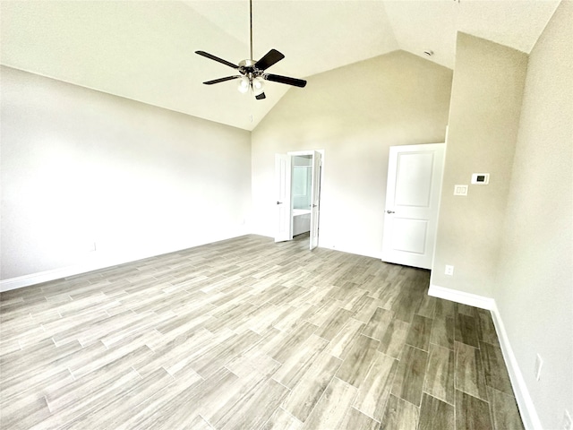 unfurnished living room featuring high vaulted ceiling, ceiling fan, and light hardwood / wood-style flooring