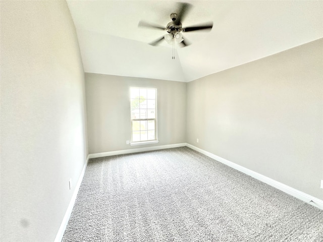 empty room featuring carpet, lofted ceiling, and ceiling fan