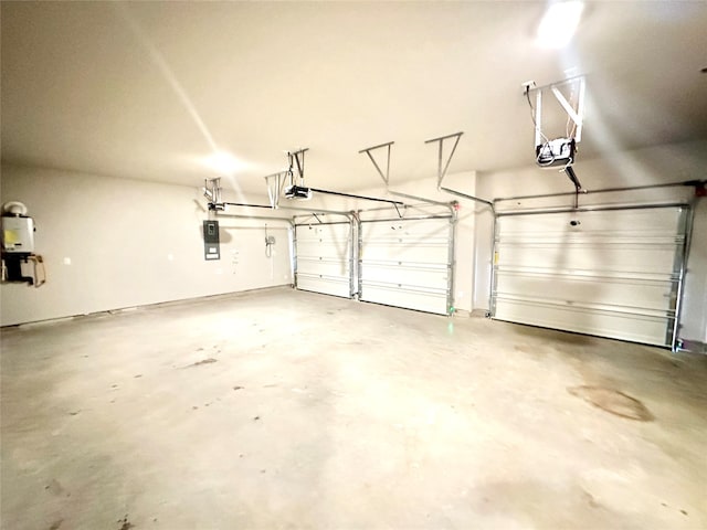 garage with electric panel, a garage door opener, and water heater