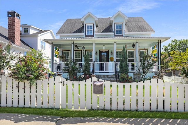 view of front of home with ceiling fan and a porch