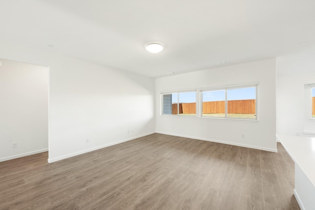 spare room featuring hardwood / wood-style flooring