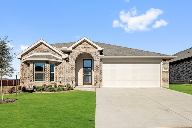 ranch-style house with a garage and a front lawn