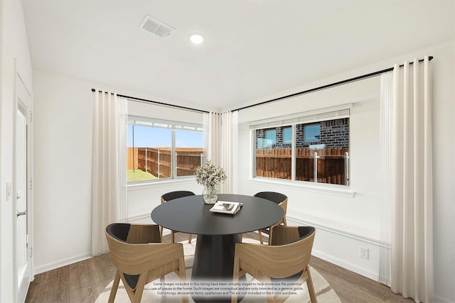 dining space featuring hardwood / wood-style flooring