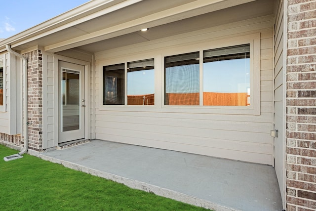 doorway to property with a patio