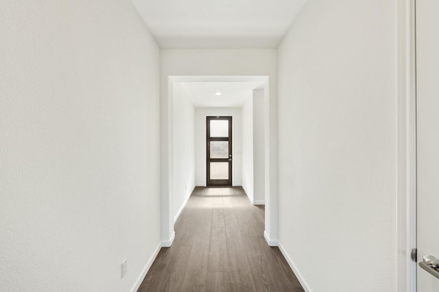 hallway featuring dark hardwood / wood-style floors