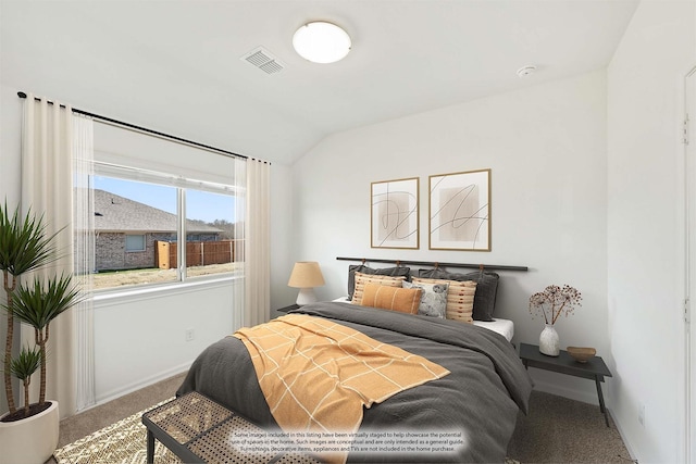 carpeted bedroom with lofted ceiling