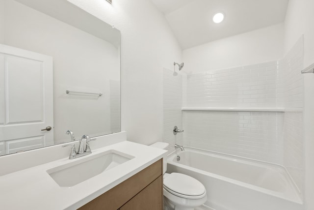 full bathroom with vanity, toilet, shower / washtub combination, and vaulted ceiling