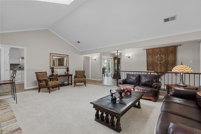 living room with carpet and high vaulted ceiling