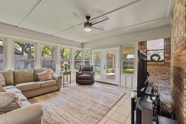 sunroom featuring ceiling fan, plenty of natural light, and french doors