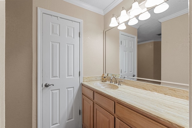 bathroom featuring ornamental molding and vanity