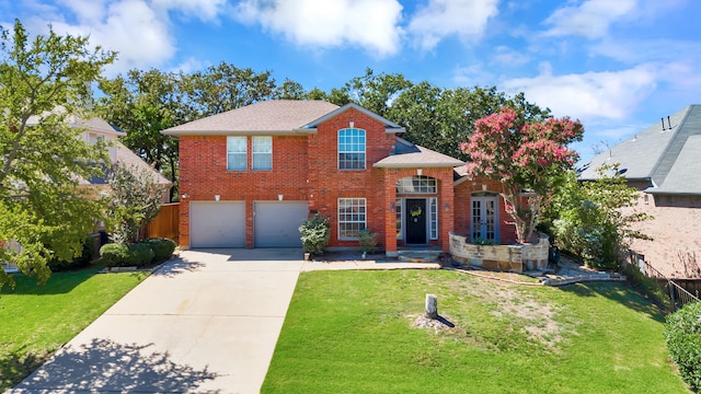 view of property with a front lawn and a garage