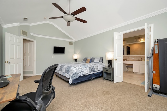 carpeted bedroom featuring crown molding, vaulted ceiling, ensuite bath, and ceiling fan