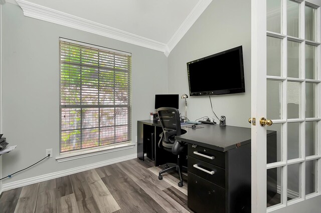 dining space featuring dark hardwood / wood-style flooring, vaulted ceiling, a notable chandelier, and crown molding