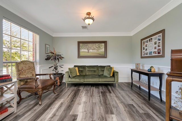 living room featuring ornamental molding and hardwood / wood-style flooring