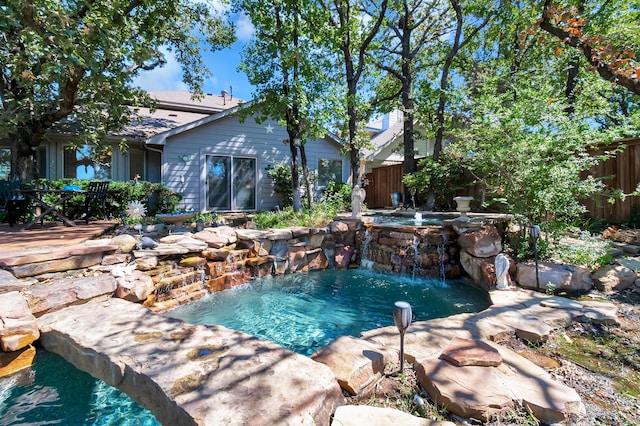 view of pool with pool water feature