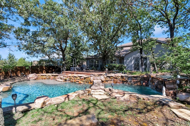 view of swimming pool featuring pool water feature