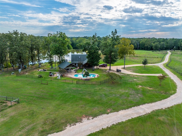 birds eye view of property with a water view